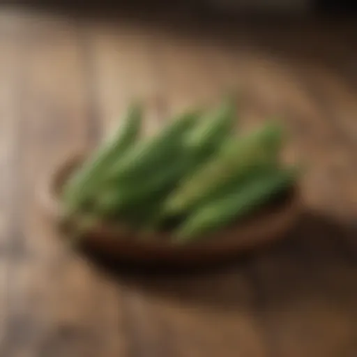 Close-up of fresh okra pods on a wooden surface